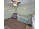 Inviting bedroom featuring a ceiling fan and nature-inspired decor at 218 Omaha St S S St, Lake Hamilton, FL 33851