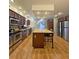 Spacious kitchen with stainless steel appliances, a center island and dark wood cabinetry at 218 Omaha St S S St, Lake Hamilton, FL 33851