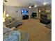 Relaxing living room with stone fireplace, mounted tv and comfortable seating at 218 Omaha St S S St, Lake Hamilton, FL 33851