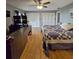 Comfortable main bedroom featuring two closets, wood floors and ceiling fan at 218 Omaha St S S St, Lake Hamilton, FL 33851