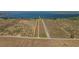 Aerial view of land with a defined property line, showcasing acreage and proximity to waterfront at 225 Wes Mann Rd, Babson Park, FL 33827