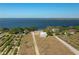 Expansive aerial view of a waterfront property, showcasing its size and proximity to the lake at 225 Wes Mann Rd, Babson Park, FL 33827