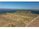 Aerial view showcases a property with lake access, highlighting its acreage and desirable location at 225 Wes Mann Rd, Babson Park, FL 33827