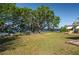 Water view with large, mature trees adding shade to the expansive backyard at 225 Wes Mann Rd, Babson Park, FL 33827