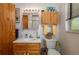 This bathroom features a wooden vanity, sink, toilet, and storage at 225 Wes Mann Rd, Babson Park, FL 33827