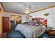 Spacious bedroom features a large bed, ceiling fan, and trim work at 225 Wes Mann Rd, Babson Park, FL 33827