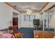 Bedroom with blue carpet, ceiling fan, and desk at 225 Wes Mann Rd, Babson Park, FL 33827