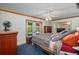 Bedroom features a ceiling fan, trim work, and access to the outdoors at 225 Wes Mann Rd, Babson Park, FL 33827