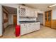 Spacious kitchen area with a wine rack, cabinets, and tile flooring extending into other rooms at 225 Wes Mann Rd, Babson Park, FL 33827
