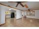 Open concept living area features tile floors, natural light, and a view into the kitchen at 225 Wes Mann Rd, Babson Park, FL 33827