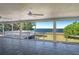 Enclosed patio with tile flooring offering beautiful views of the surrounding waterfront at 225 Wes Mann Rd, Babson Park, FL 33827