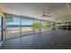Enclosed patio features tile flooring and an unobstructed water view at 225 Wes Mann Rd, Babson Park, FL 33827