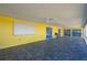 Spacious enclosed patio with tile floors and yellow exterior walls with blue trim at 225 Wes Mann Rd, Babson Park, FL 33827