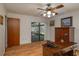 Bedroom has hardwood floors and direct access to sunroom at 23 Kendra Ct, Winter Haven, FL 33880
