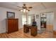 Bedroom features a ceiling fan and a mirrored closet at 23 Kendra Ct, Winter Haven, FL 33880