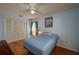 Bedroom with hardwood floors, light blue walls and a double door closet at 23 Kendra Ct, Winter Haven, FL 33880