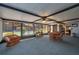Enclosed patio with views of the pool and features a sitting area with a table and chairs at 23 Kendra Ct, Winter Haven, FL 33880