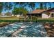 Community recreation area with benches and shuffleboard courts at 23 Kendra Ct, Winter Haven, FL 33880