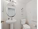Bathroom features pedestal sink, tile floors and white toilet at 247 Cobalt Dr, Kissimmee, FL 34758