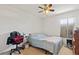 Functional bedroom featuring neutral carpet, a window with blinds, and an overhead ceiling fan with lights at 247 Cobalt Dr, Kissimmee, FL 34758