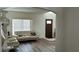 Bright living room with new floors, updated furniture and arched entry offers a cozy atmosphere at 247 Cobalt Dr, Kissimmee, FL 34758