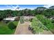 Beautiful property with large lot, mature trees and plenty of natural light and a partially visible house at 2750 W Lake Hamilton Dr, Winter Haven, FL 33881