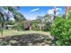 Expansive backyard with beautiful mature trees providing ample shade at 2750 W Lake Hamilton Dr, Winter Haven, FL 33881
