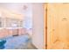 Bright bathroom featuring a large vanity with dual sinks and a separate tub area at 2750 W Lake Hamilton Dr, Winter Haven, FL 33881
