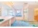 Bright bathroom featuring a large vanity with dual sinks and a separate shower at 2750 W Lake Hamilton Dr, Winter Haven, FL 33881