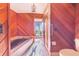 Unique bathroom with wood-paneled walls, large tub, and walk in shower at 2750 W Lake Hamilton Dr, Winter Haven, FL 33881
