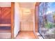 Bathroom with wooden walls, large window, a bathtub and a modern sink cabinet at 2750 W Lake Hamilton Dr, Winter Haven, FL 33881