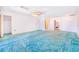 Spacious bedroom with multiple doors to closet and in-suite bathroom at 2750 W Lake Hamilton Dr, Winter Haven, FL 33881