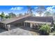 Unique home featuring a carport with stone columns and a spacious driveway at 2750 W Lake Hamilton Dr, Winter Haven, FL 33881
