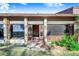 Home's front entrance featuring stone columns at 2750 W Lake Hamilton Dr, Winter Haven, FL 33881