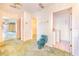 Hallway area with access to the Primary bath, walk-in closet, and laundry room at 2750 W Lake Hamilton Dr, Winter Haven, FL 33881