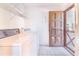 Functional laundry room with a side exit door at 2750 W Lake Hamilton Dr, Winter Haven, FL 33881