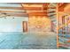 Spacious living room featuring stone accent wall, wooden ceiling beams, and a spiral staircase at 2750 W Lake Hamilton Dr, Winter Haven, FL 33881