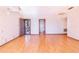 Open living room featuring hardwood floors and open access to multiple rooms at 2750 W Lake Hamilton Dr, Winter Haven, FL 33881