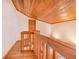 Wooden loft featuring wooden railings and a view of the living room below at 2750 W Lake Hamilton Dr, Winter Haven, FL 33881