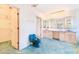 Spacious main bathroom with a long vanity, dual sinks, and a walk-in closet entrance at 2750 W Lake Hamilton Dr, Winter Haven, FL 33881