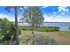 Picturesque water view with lush greenery along the shore and clear skies overhead, offering tranquility and natural beauty at 2750 W Lake Hamilton Dr, Winter Haven, FL 33881