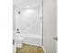 Modern bathroom featuring white tile shower and tub at 3120 Oleander Dr, Indian Lake Estates, FL 33855