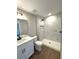 Modern bathroom featuring a stand-up shower with marble-look tile and modern fixtures at 3120 Oleander Dr, Indian Lake Estates, FL 33855