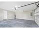 A large garage with a door to the house and a door to the exterior at 3120 Oleander Dr, Indian Lake Estates, FL 33855