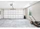 Spacious two car garage features concrete floors and lots of room for storage at 3120 Oleander Dr, Indian Lake Estates, FL 33855