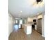 Open-concept kitchen with a central island, stainless steel appliances, and recessed lighting at 3120 Oleander Dr, Indian Lake Estates, FL 33855