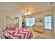 Bright bedroom featuring a whimsical design and carpeted floors, creating a cozy atmosphere at 329 Hamilton Shores Ne Dr, Winter Haven, FL 33881