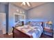 Comfortable bedroom with neutral walls, mirrored closet doors and wood flooring at 329 Hamilton Shores Ne Dr, Winter Haven, FL 33881