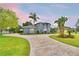 Charming two-story home with well-maintained landscaping and a spacious circular driveway at 329 Hamilton Shores Ne Dr, Winter Haven, FL 33881
