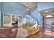 Airy living room featuring soaring ceilings, built-in shelving, and a staircase at 329 Hamilton Shores Ne Dr, Winter Haven, FL 33881